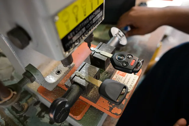 Car key being duplicated with a key cutting machine. The startup budget for a locksmith business and the ways to finance it